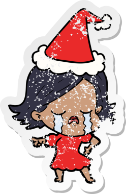 Ağlayan ve Noel Baba şapkası takan bir kızın karikatürü. Bir insan tarafından çizilmiş.