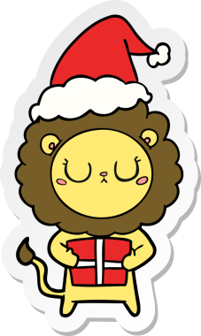 Bir insan tarafından çizilmiş Noel Baba şapkası giymiş bir aslanın el çizimi karikatürü.