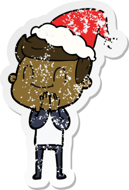 Bir insan tarafından çizilmiş, dost canlısı, Noel Baba şapkası takan bir adamın sıkıntılı çıkartması.