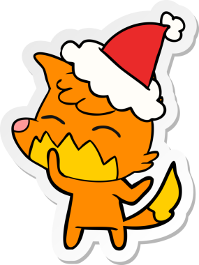 Bir insan tarafından çizilmiş Noel Baba şapkası giyen bir tilkinin el çizimi karikatürü.