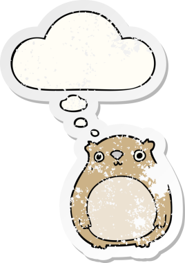 Düşünce baloncuğu olan çizgi film ayısı bir insan tarafından çizilmiş yıpranmış bir çıkartma.