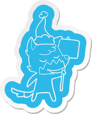 Bir insan tarafından çizilmiş Noel Baba şapkası giyen bir tilkinin dostça bir çizgi film çıkartması.