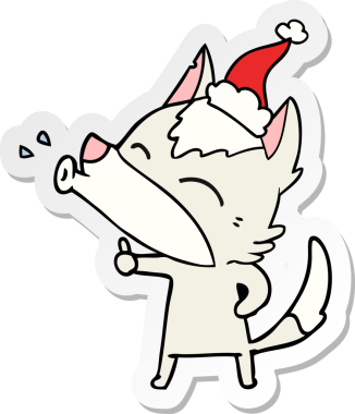 Uluyan kurt eli bir insan tarafından çizilmiş Noel Baba şapkasının çıkartması.