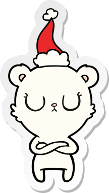 Bir insan tarafından çizilmiş Noel Baba şapkası giyen bir kutup ayısının barışçıl el yazısı.