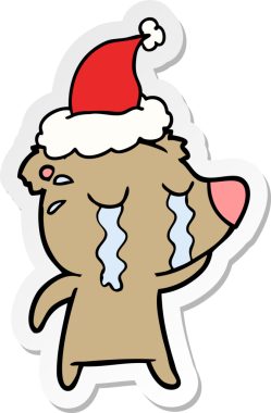 Bir insan tarafından çizilmiş Noel Baba şapkası takan ağlayan bir ayının el yazısı.