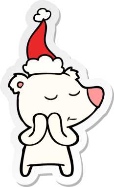 Bir insan tarafından çizilmiş Noel Baba şapkası giyen bir kutup ayısının mutlu el çizimi karikatürü.