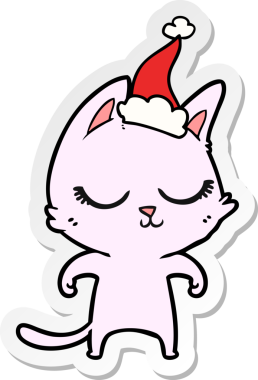 Sakin el çizimi bir insan tarafından çizilmiş Noel Baba şapkası takan bir kedi.
