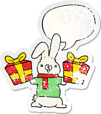 Karikatür tavşanı Noel hediyesi olarak konuşma baloncuğu sunar. Bir insan tarafından çizilmiş sıkıntılı eski bir çıkartma.