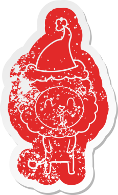 Gülen aslan çizgi filmi, bir insan tarafından çizilmiş Noel Baba şapkasının çıkartması.