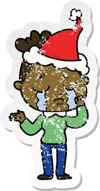 Bir insan tarafından çizilmiş, ağlayan, Noel Baba şapkası takan bir kadın.