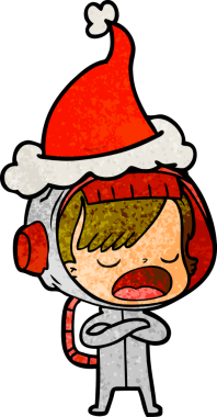 Bir astronot kadının insan tarafından çizilmiş Noel Baba şapkası giydiğini anlatan el çizimi bir karikatür.