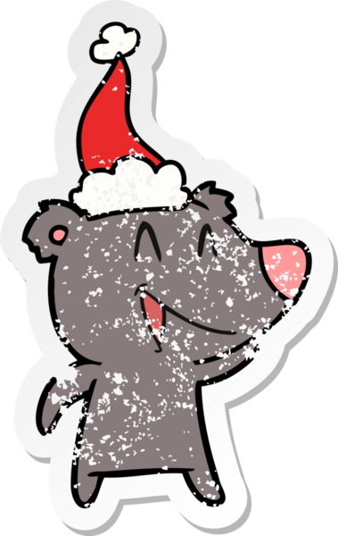 Gülen ayı eli, bir insan tarafından çizilmiş Noel Baba şapkasının sıkıntılı çıkartmasını çizmiş.