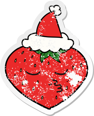 Bir insan tarafından çizilmiş Noel Baba şapkası takan çilekli bir el yazısı.