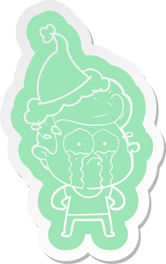 Bir insan tarafından çizilmiş Noel Baba şapkası giyen ağlayan bir adamın garip çizgi film çıkartması.