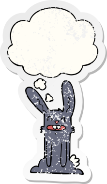 Düşünce baloncuğu olan çizgi film tavşanı insan tarafından çizilmiş yıpranmış bir çıkartma.