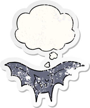 Düşünce baloncuğu olan karikatür vampir yarasası bir insan tarafından çizilmiş yıpranmış bir çıkartma.