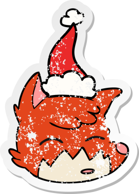 Bir insan tarafından çizilmiş Noel Baba şapkası giymiş tilki suratlı bir karikatür.