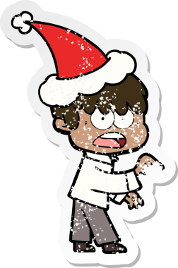 Endişeli bir el, bir insan tarafından çizilmiş Noel Baba şapkası takan bir çocuğun üzgün çıkartmasını çizdi.