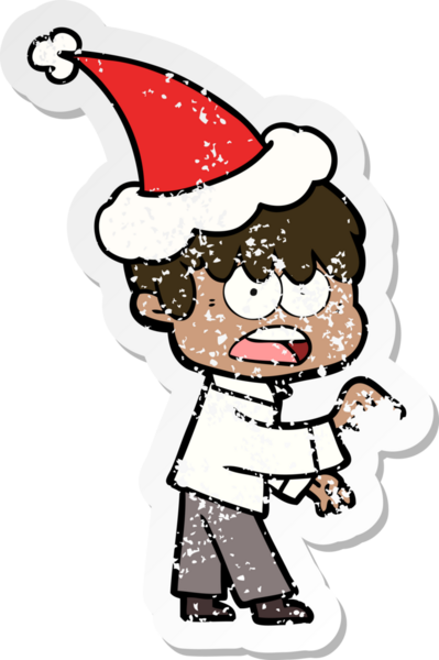 Endişeli bir el, bir insan tarafından çizilmiş Noel Baba şapkası takan bir çocuğun üzgün çıkartmasını çizdi.