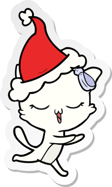 Bir insan tarafından çizilmiş Noel Baba şapkası takan bir kedinin el yazısı.