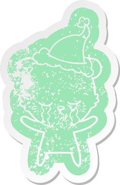 Ağlayan karikatür, bir insan tarafından çizilmiş Noel Baba şapkası giyen bir kutup ayısının etiketi.