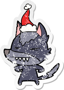 Kızgın kurt eli, bir insan tarafından çizilmiş Noel Baba şapkasının üzgün çıkartmasını çizmiş.