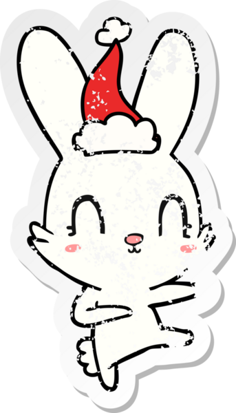 Bir insan tarafından çizilmiş Noel Baba şapkasıyla dans eden bir tavşan çizilmiş.