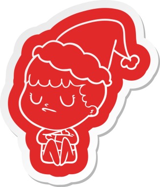 Bir insan tarafından çizilmiş Noel Baba şapkası giyen huysuz bir çocuğun garip çizgi film etiketi.