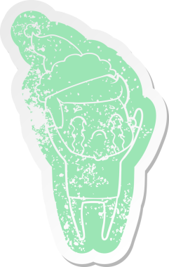 Garip bir çizgi film. Ağlayan bir adamın çıkartması. Bir insan tarafından çizilmiş Noel Baba şapkasıyla.