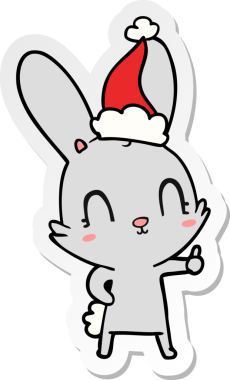 Bir insan tarafından çizilmiş Noel Baba şapkası takan bir tavşan çizimi.