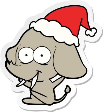 Mutlu el çizimi bir insan tarafından çizilmiş Noel Baba şapkası takan bir fil.