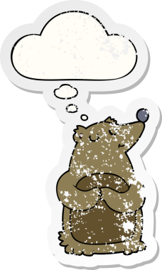 Düşünce baloncuğu olan çizgi film ayısı bir insan tarafından çizilmiş yıpranmış bir çıkartma.