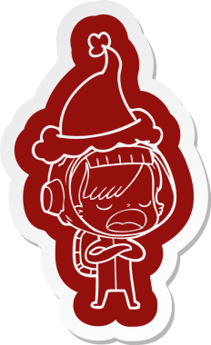 Bir astronot kadının insan tarafından çizilmiş Noel Baba şapkası giydiğini açıklayan garip bir karikatür çıkartması.