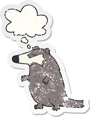 Düşünce baloncuğu olan çizgi film porsuğu bir insan tarafından çizilmiş yıpranmış bir çıkartma.