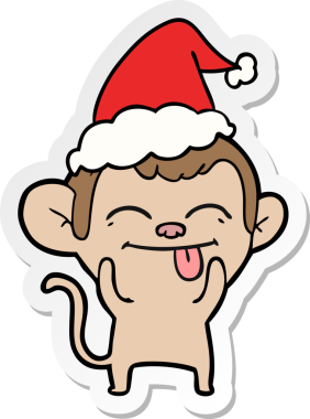 Bir insan tarafından çizilmiş Noel Baba şapkası takan bir maymunun komik el yazısı.