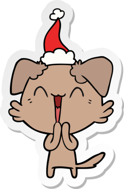 Gülen küçük köpek eli insan tarafından çizilmiş bir Noel Baba şapkasının çıkartması.