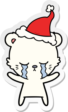 Ağlayan el çizimi bir kutup ayısının insan tarafından çizilmiş Noel Baba şapkası.