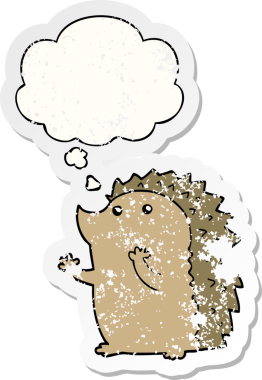 Düşünce baloncuğu olan çizgi film kirpisi insan tarafından çizilmiş yıpranmış bir çıkartma.