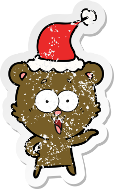 Gülen ayıcığın eli, insan tarafından çizilmiş Noel Baba şapkasının üzgün çıkartması çizilmiş.