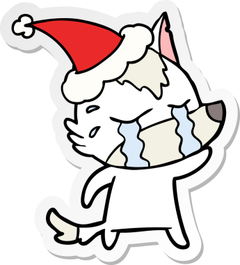 Ağlayan bir kurdun insan tarafından çizilmiş Noel Baba şapkası taktığı el yazısı.