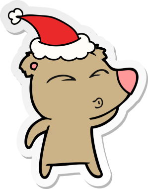 Bir insan tarafından çizilmiş Noel Baba şapkası giyen ıslık çalan bir ayının el yazısı.