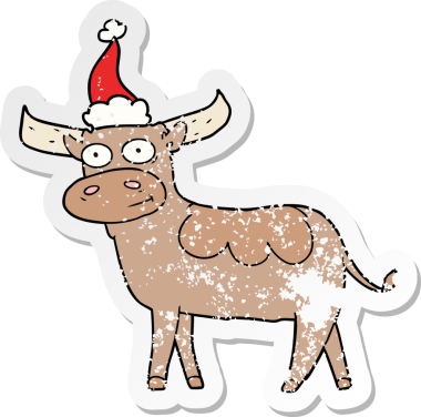 Bir insan tarafından çizilmiş Noel Baba şapkası giymiş bir boğanın çizilmiş el yazısı.