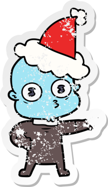 Bir insan tarafından çizilmiş Noel Baba şapkası giymiş garip kel bir uzaylının çizilmiş el yazısı.