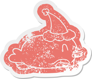 Penguen göbeğinde bir insan tarafından çizilmiş Noel Baba şapkası var.