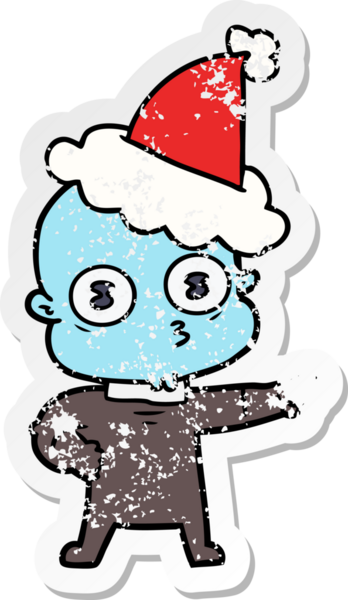 Bir insan tarafından çizilmiş Noel Baba şapkası giymiş garip kel bir uzaylının çizilmiş el yazısı.