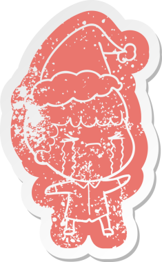 Garip bir çizgi film. Ağlayan bir adamın çıkartması. Bir insan tarafından çizilmiş Noel Baba şapkasıyla.