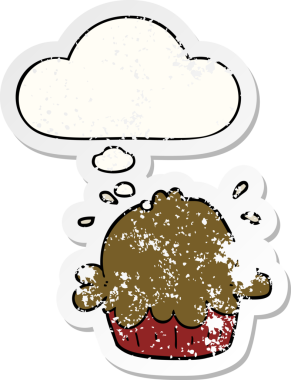 Düşünce baloncuğu olan şirin bir çizgi film pastası bir insan tarafından çizilmiş yıpranmış bir çıkartma gibi.