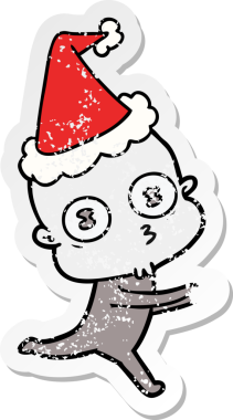 Bir insan tarafından çizilmiş Noel Baba şapkasıyla koşan kel bir uzaylının çizilmiş el yazısı.