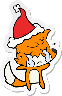 Ağlayan tilki eli bir insan tarafından çizilmiş Noel Baba şapkasının çıkartması.