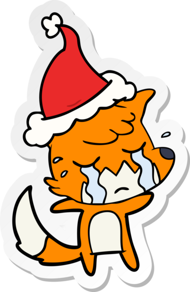 Ağlayan tilki eli bir insan tarafından çizilmiş Noel Baba şapkasının çıkartması.